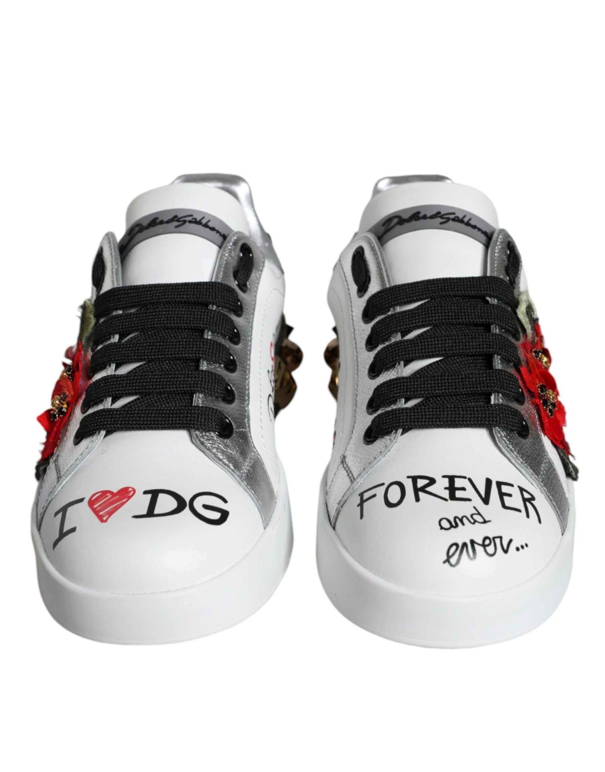 Pair of white sneakers with red and black accents, featuring handwritten messages on sides