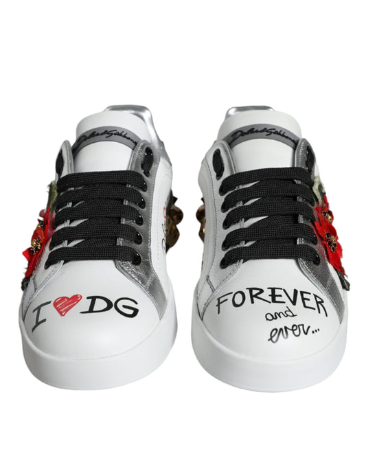 Pair of white sneakers with red and black accents, featuring handwritten messages on sides