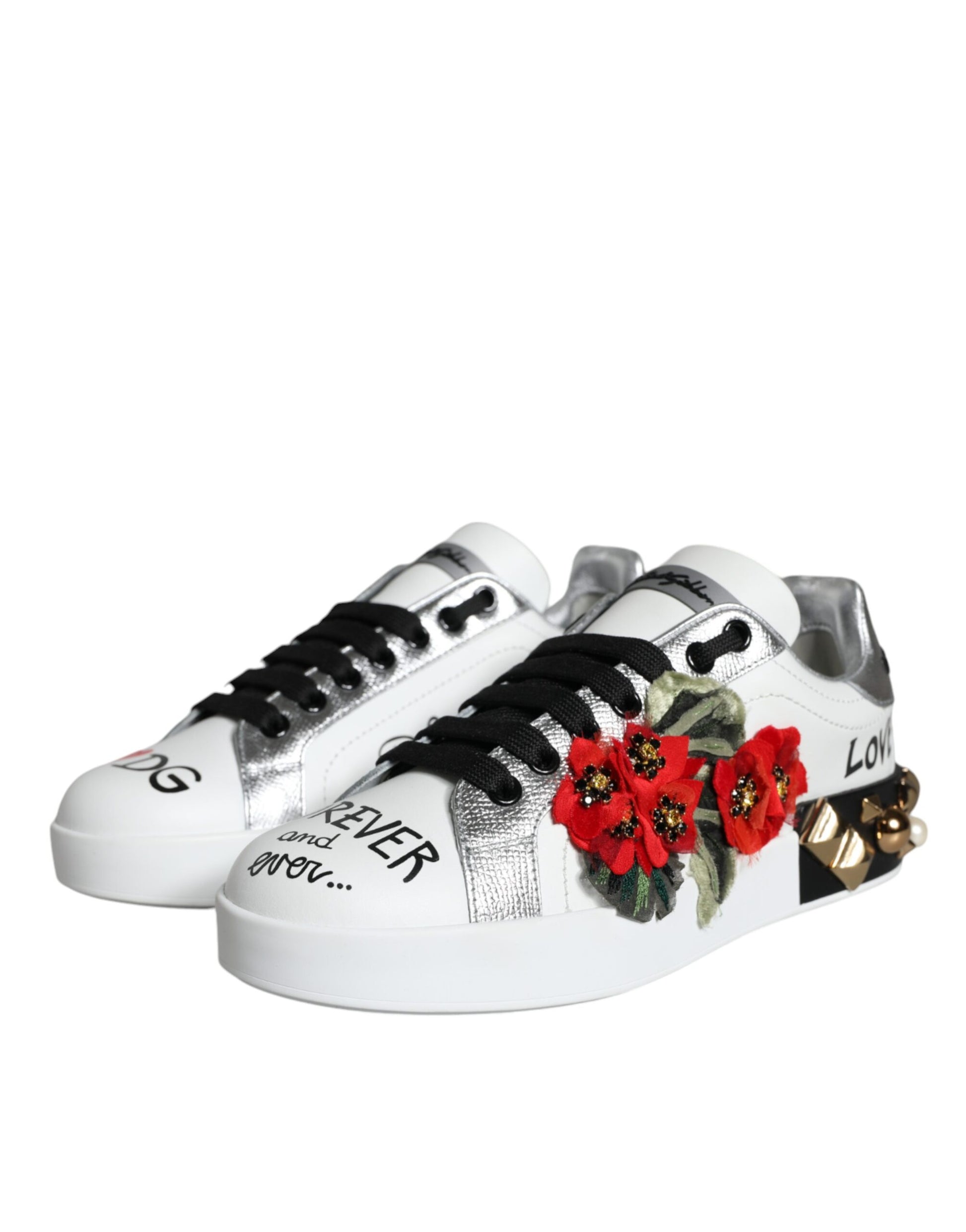 Pair of white sneakers with black laces and red flower embroidery on side