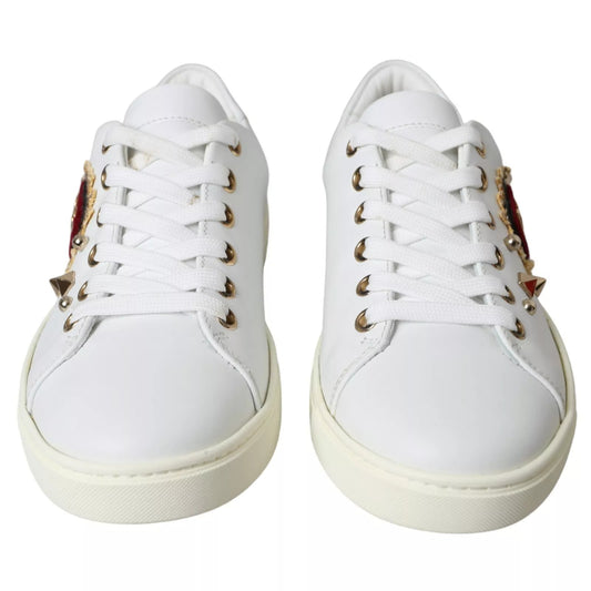 White sneakers with gold accents on laces