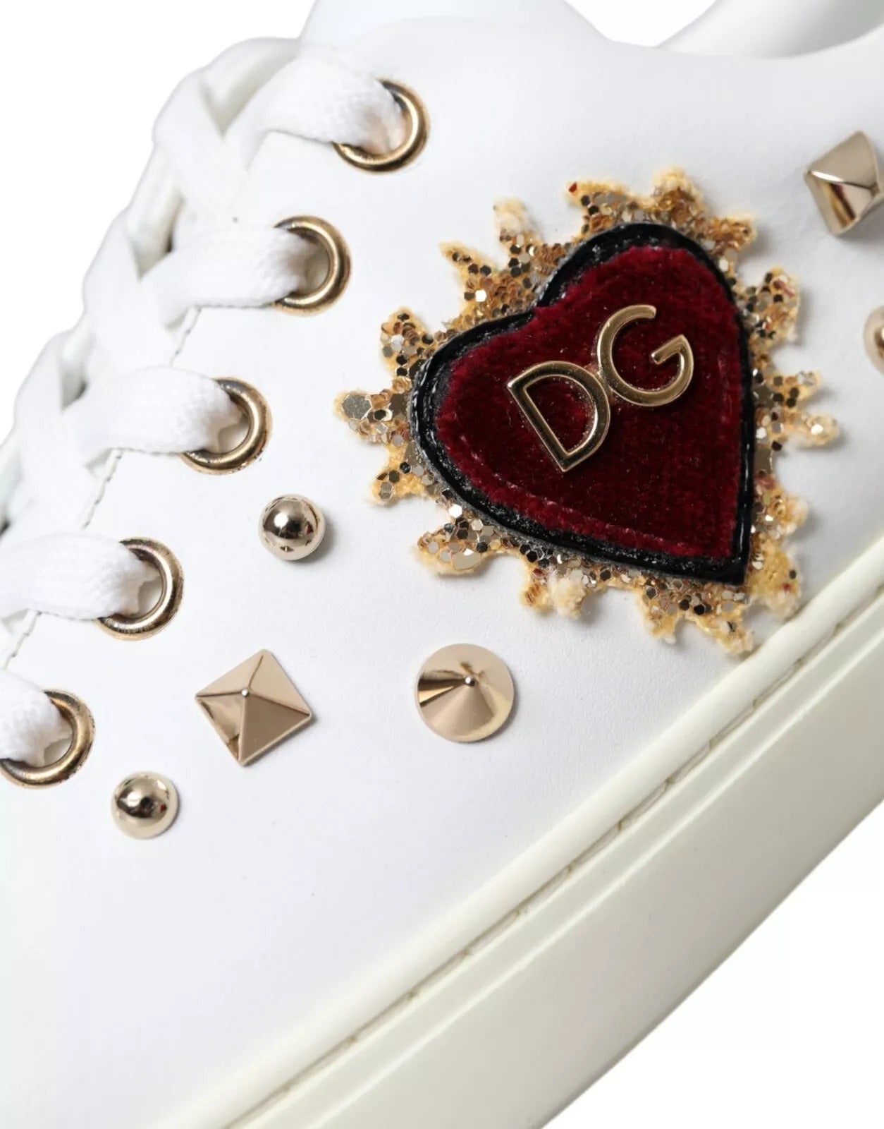White sneaker with heart design on side