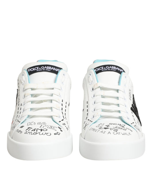 Pair of white sneakers with blue laces and writing on side