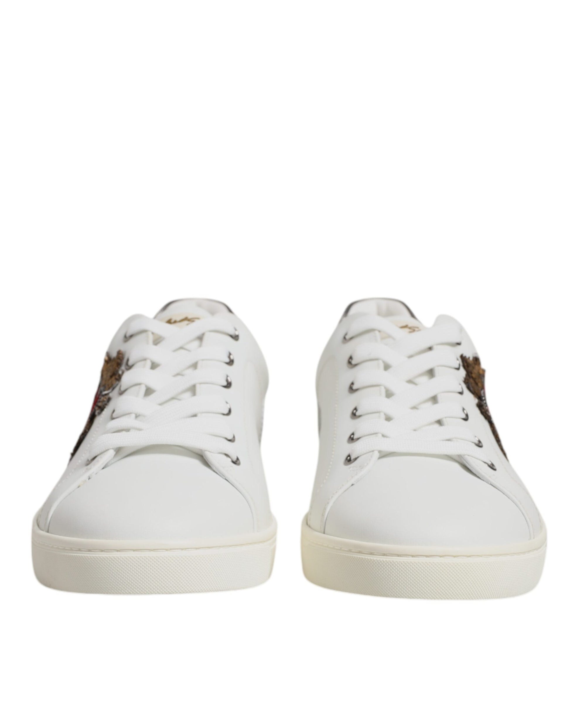 Pair of white sneakers with brown accents