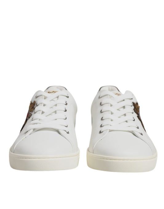 Pair of white sneakers with brown laces