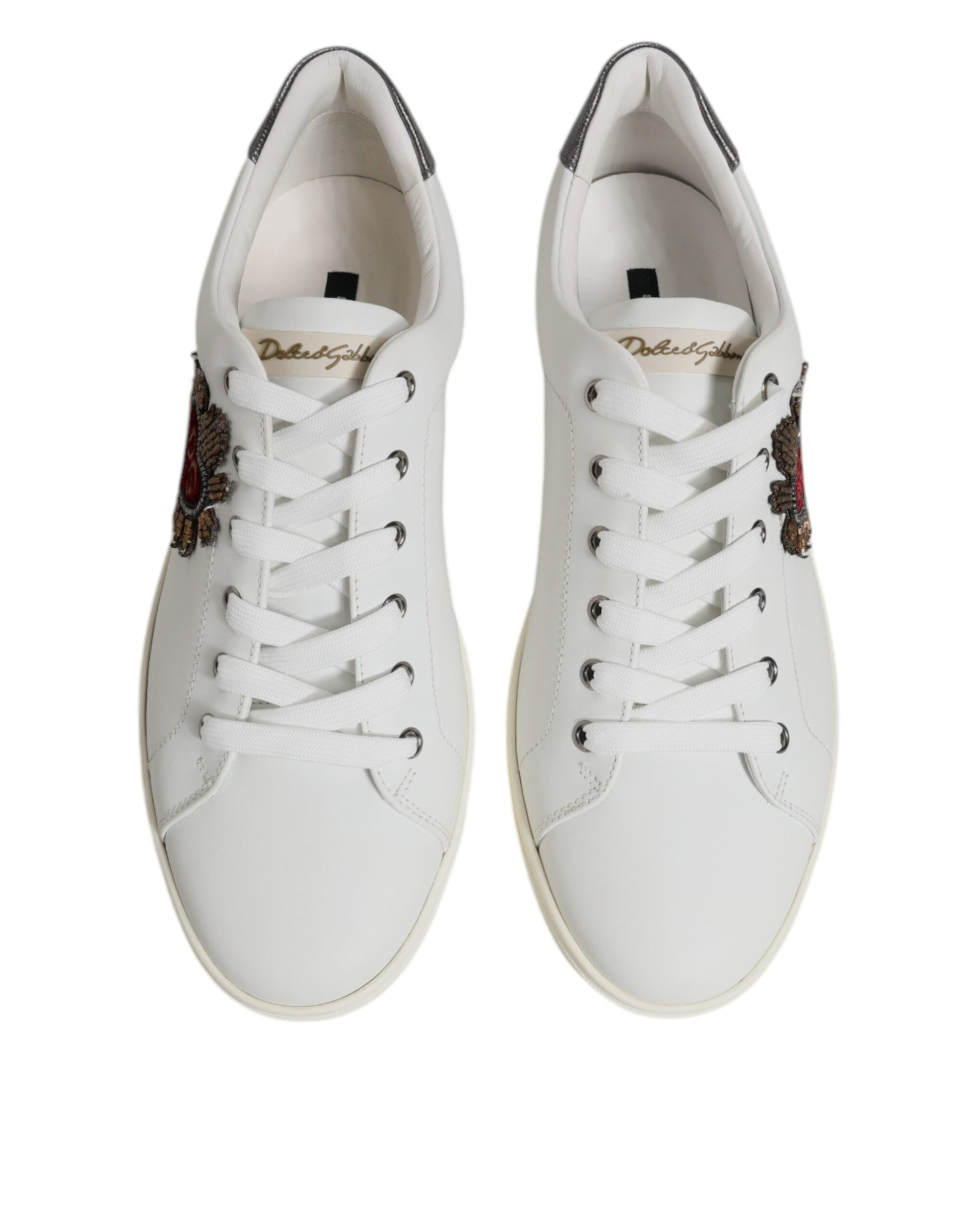 Pair of white sneakers with black laces