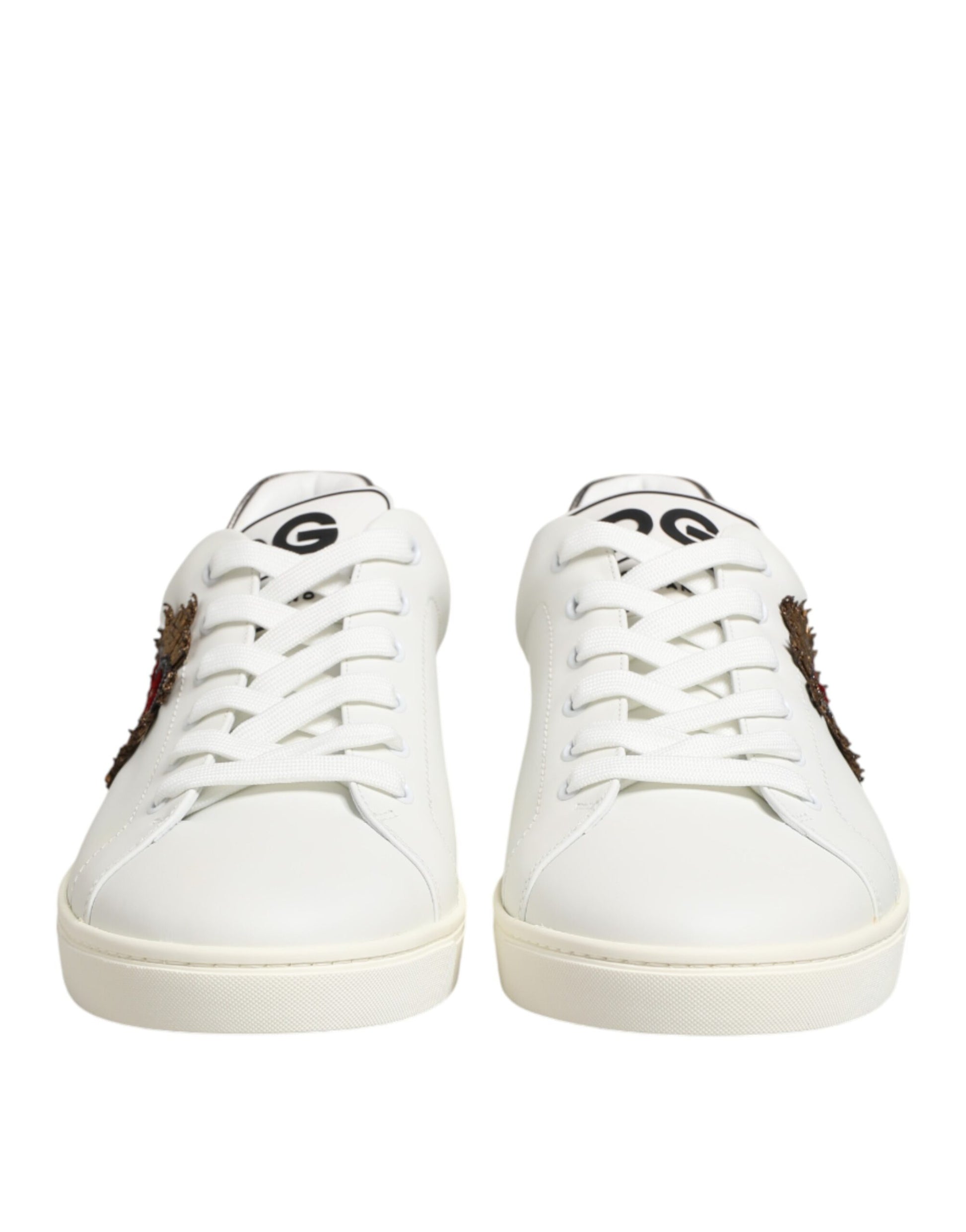 Pair of white leather sneakers with heart embellishment and laces, by Dolce & Gabbana