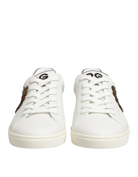 Pair of white leather sneakers with heart embellishment and laces, by Dolce & Gabbana