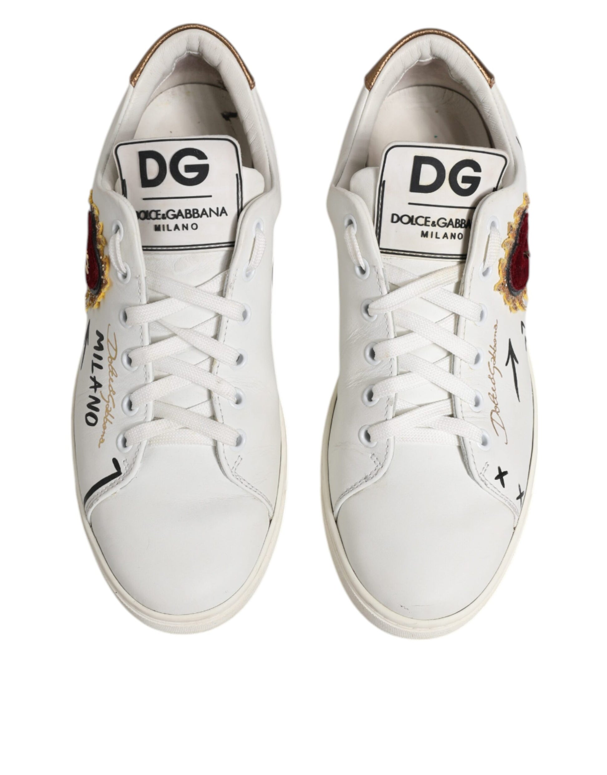 White sneakers with black laces and red logo on side
