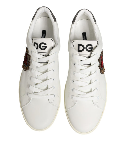 Pair of white leather sneakers with heart embellishment and brand logo on side