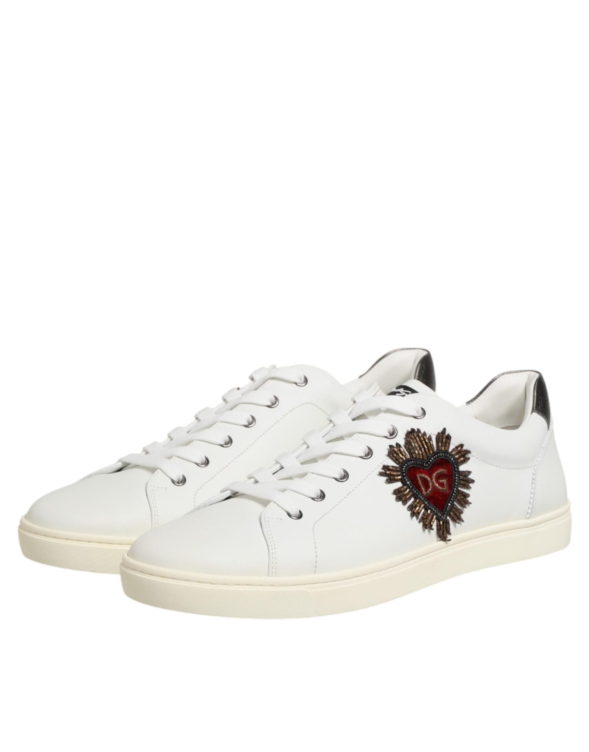 White leather sneakers with heart embellishment on side