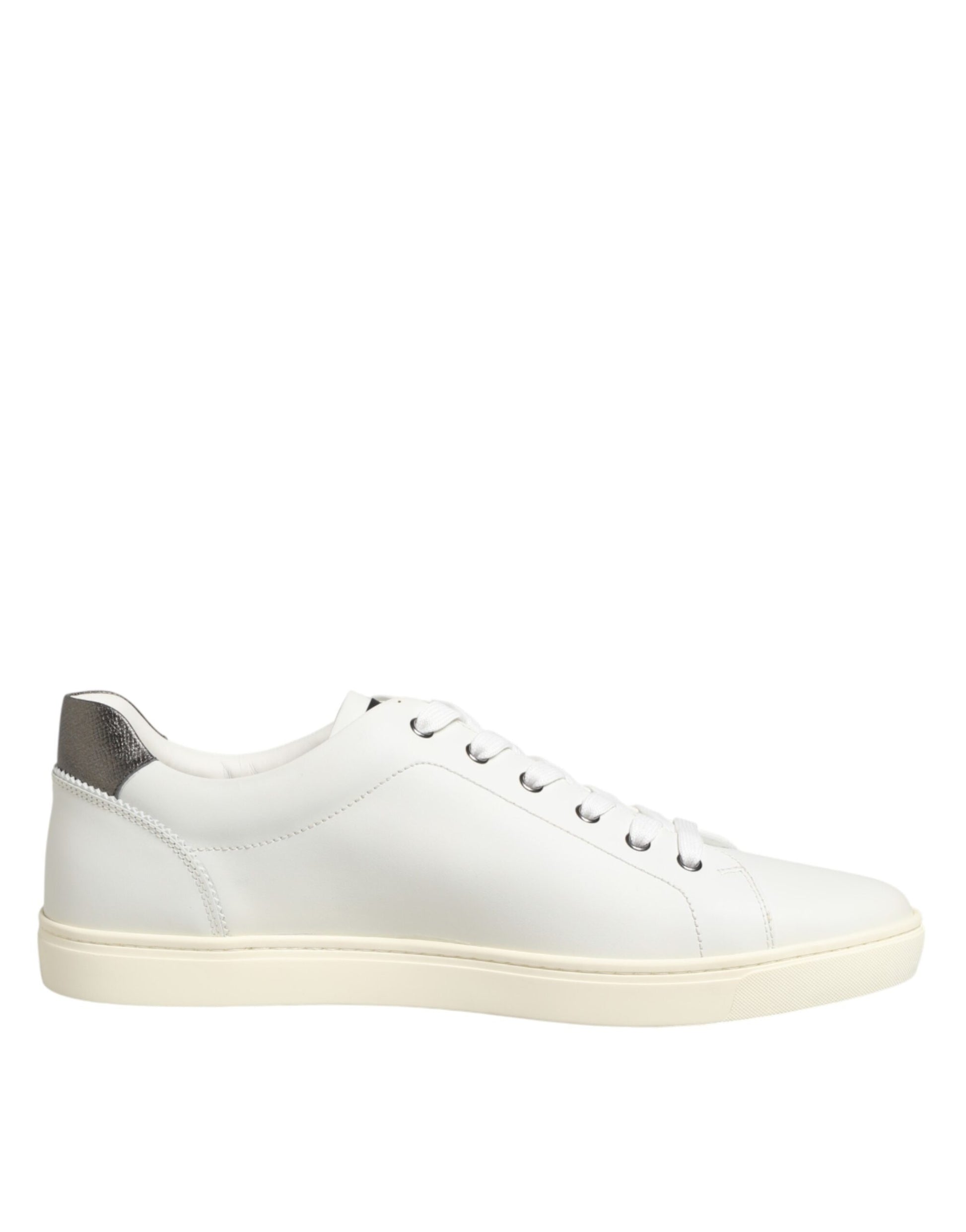 White leather sneakers with heart embellishment and tan soles