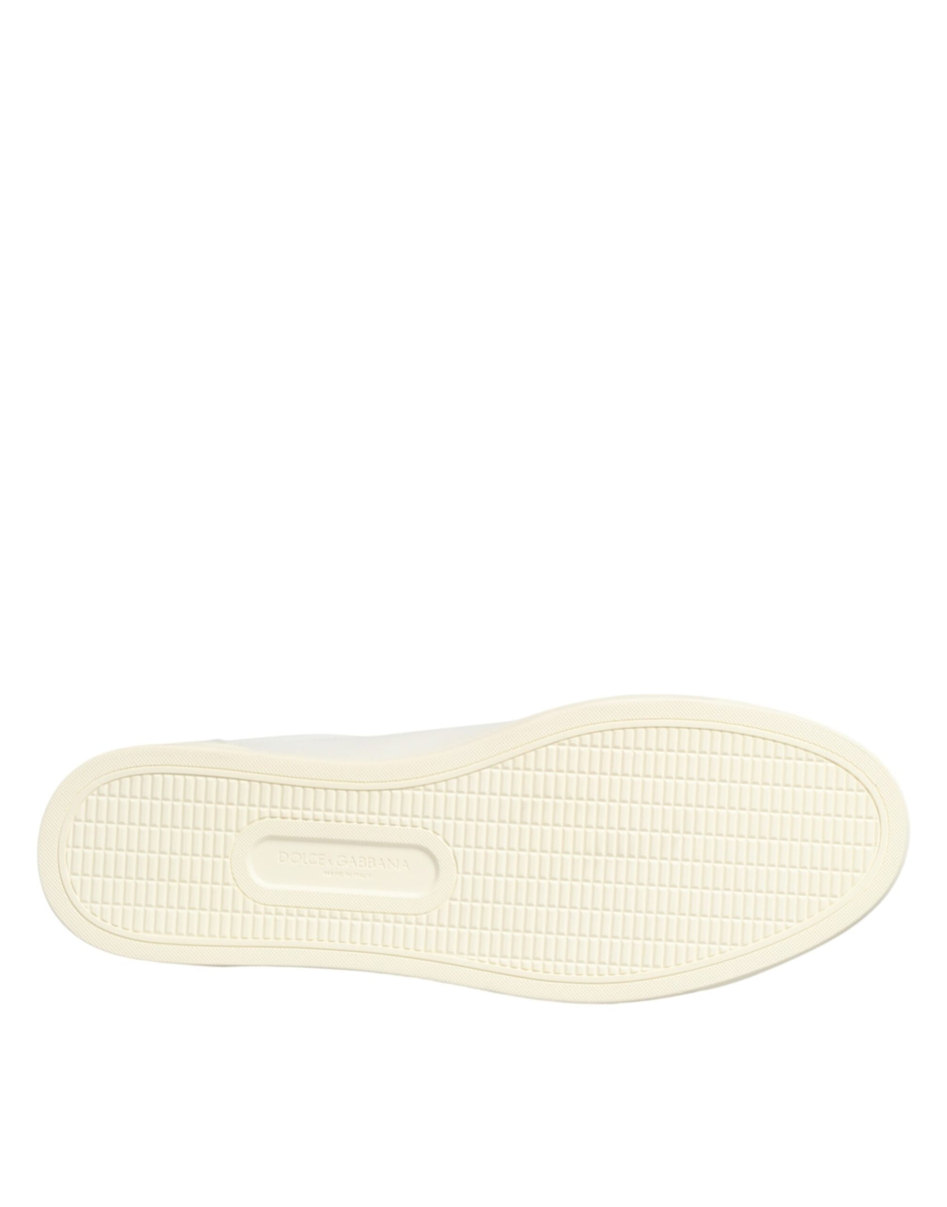 A single white leather sneaker with a heart embellishment on the side