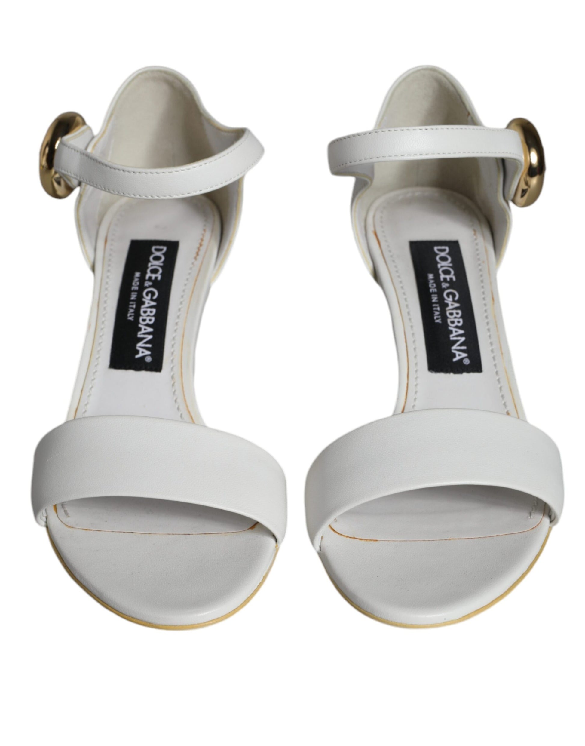 White strappy heels with gold accents