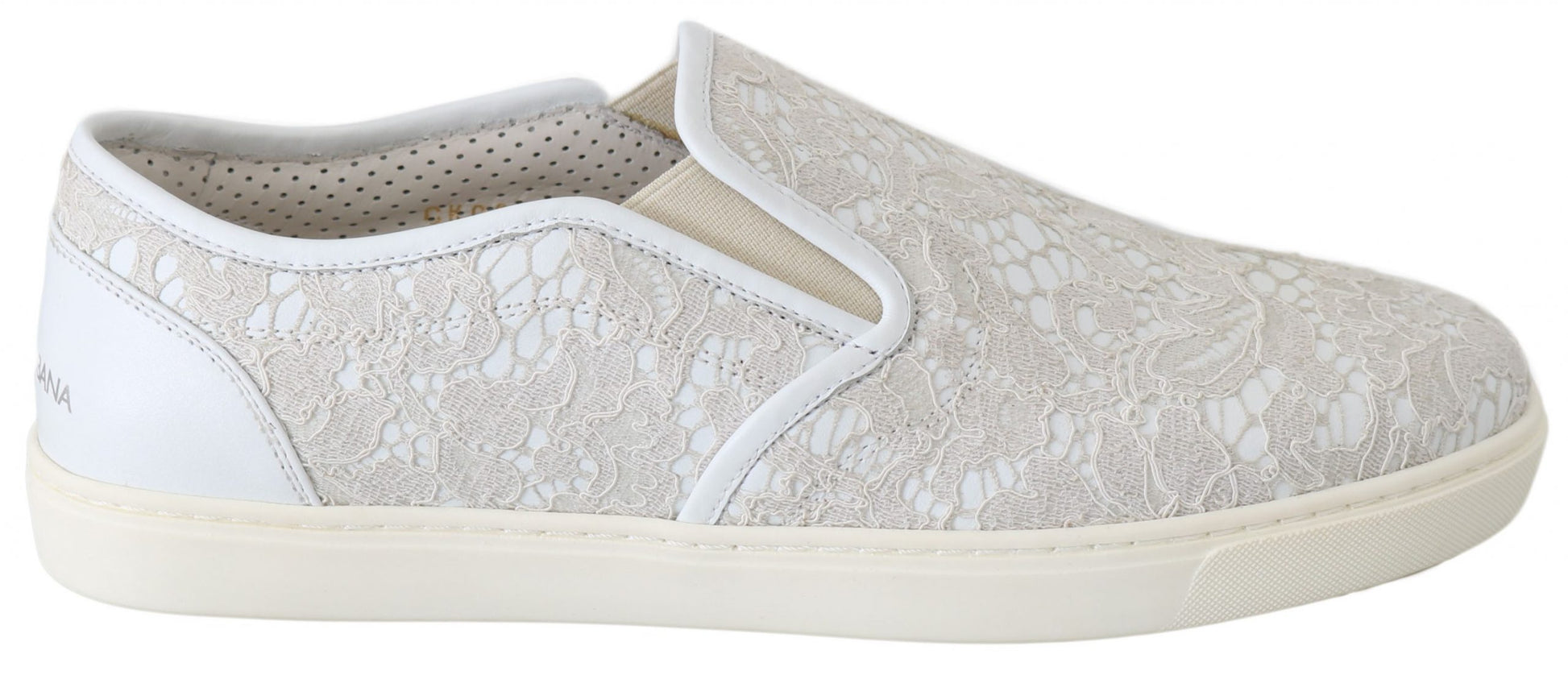 Pair of women's slip on shoes with floral pattern and white soles