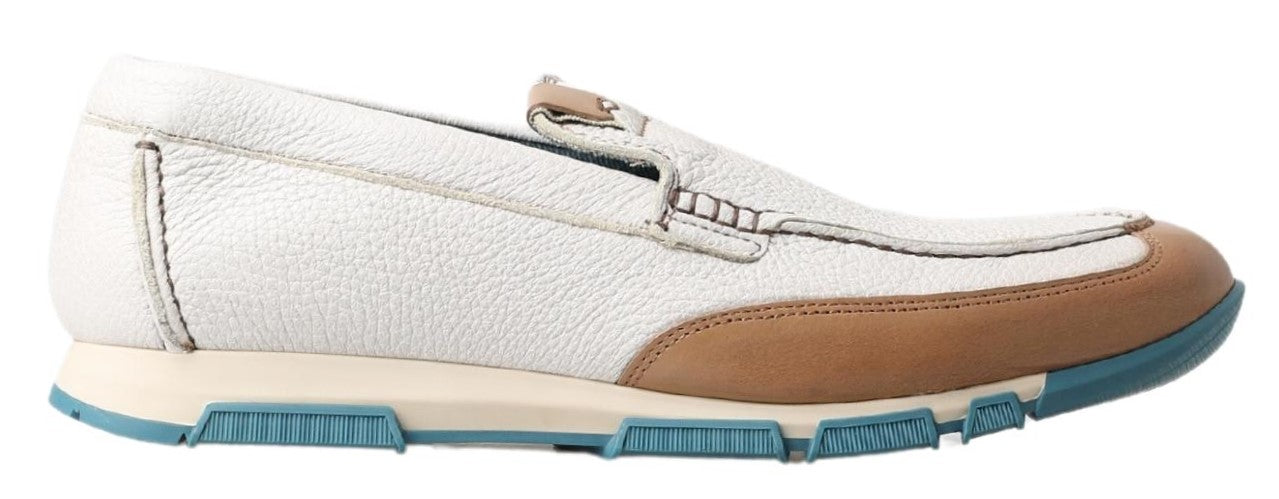 Brown and white slip on shoe with blue sole