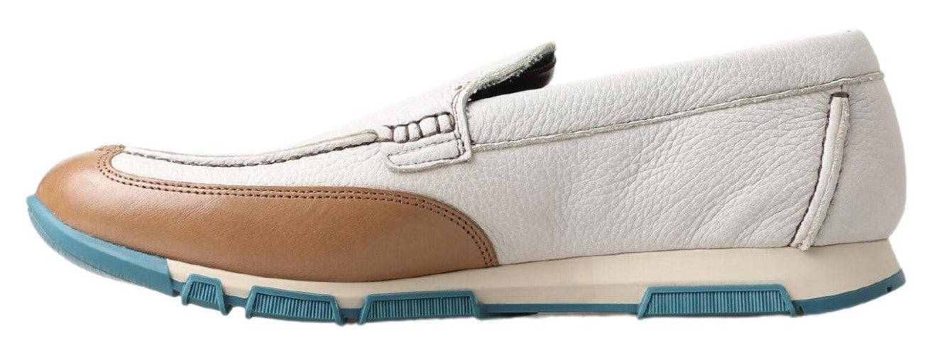 White sneaker with blue sole and tan accents