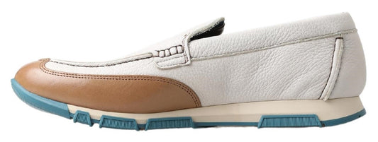White sneaker with blue sole and tan accents