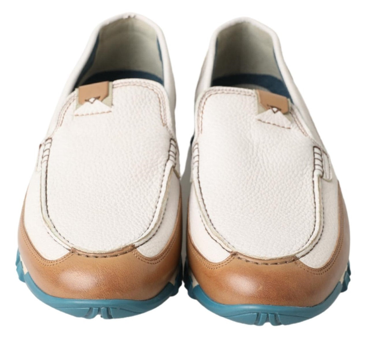 Pair of brown and white loafers with blue trim