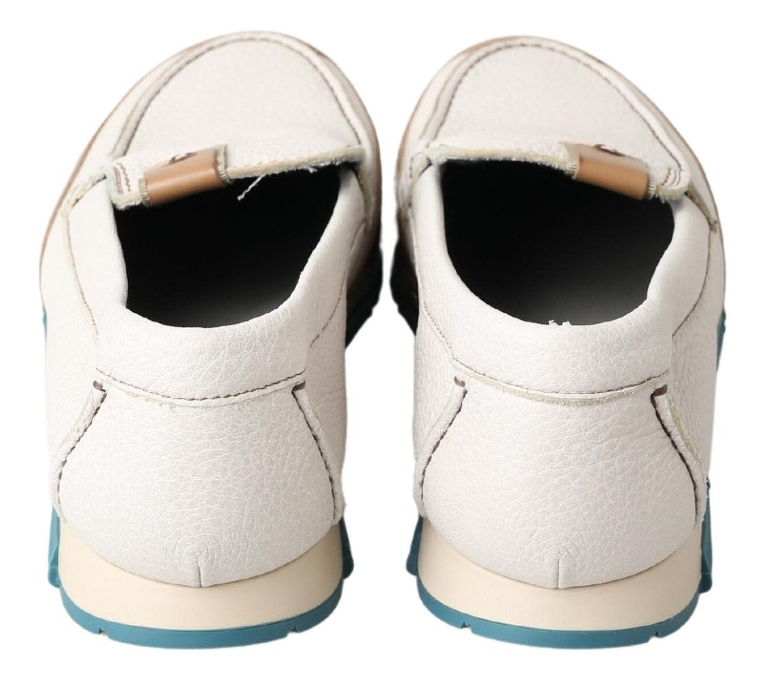 Pair of white sneakers with blue trim