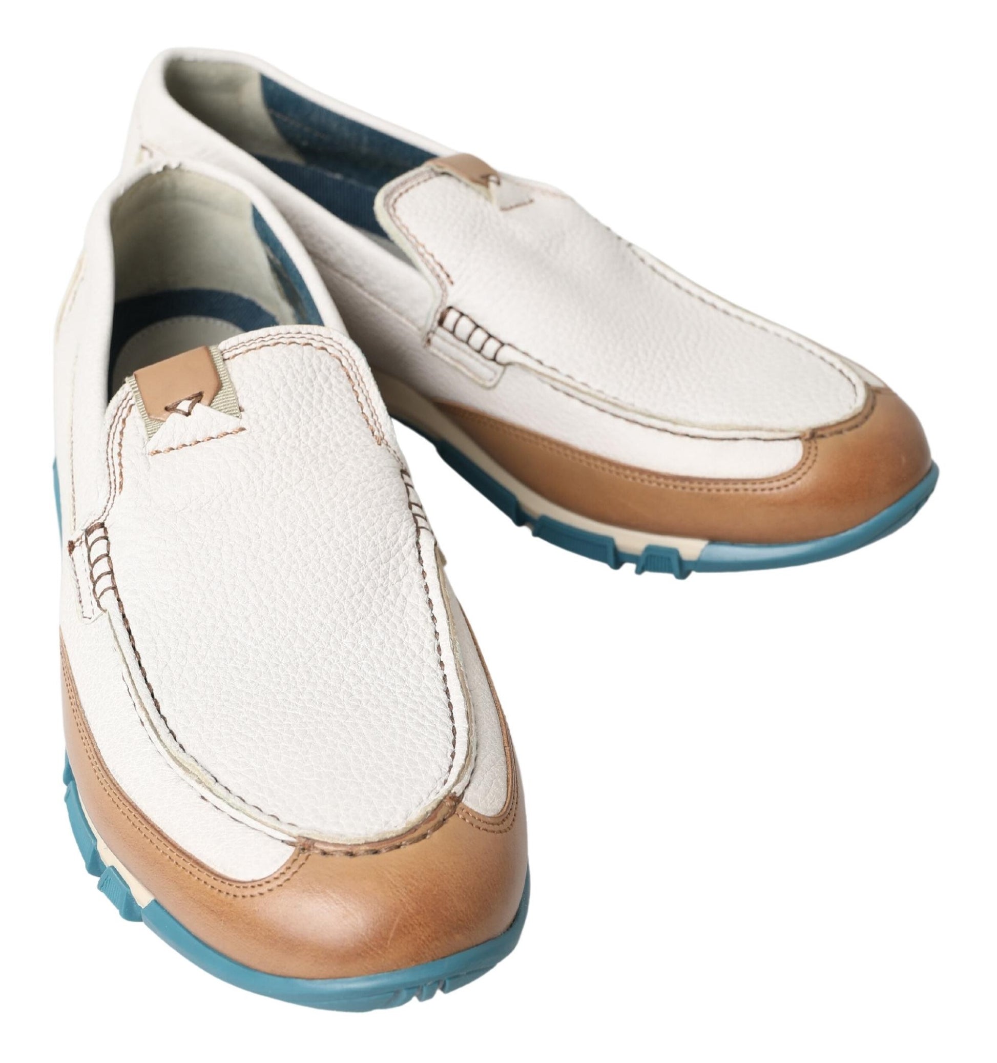Pair of brown and white loafers with blue trim