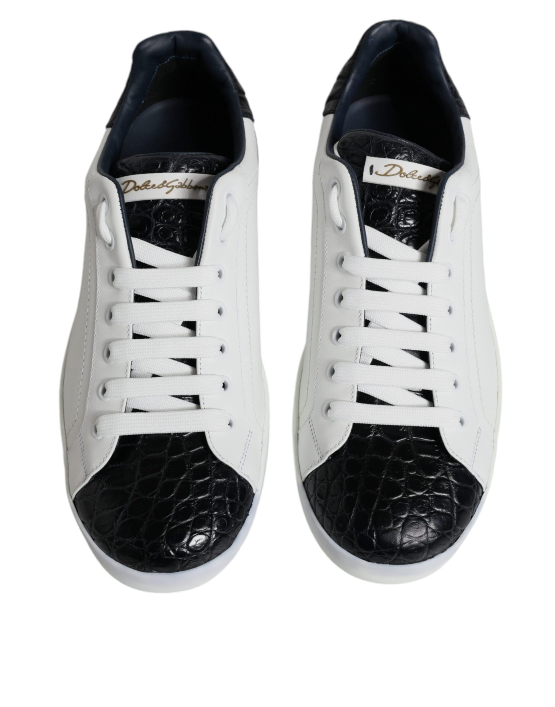 Pair of sneakers with black laces and a white sole