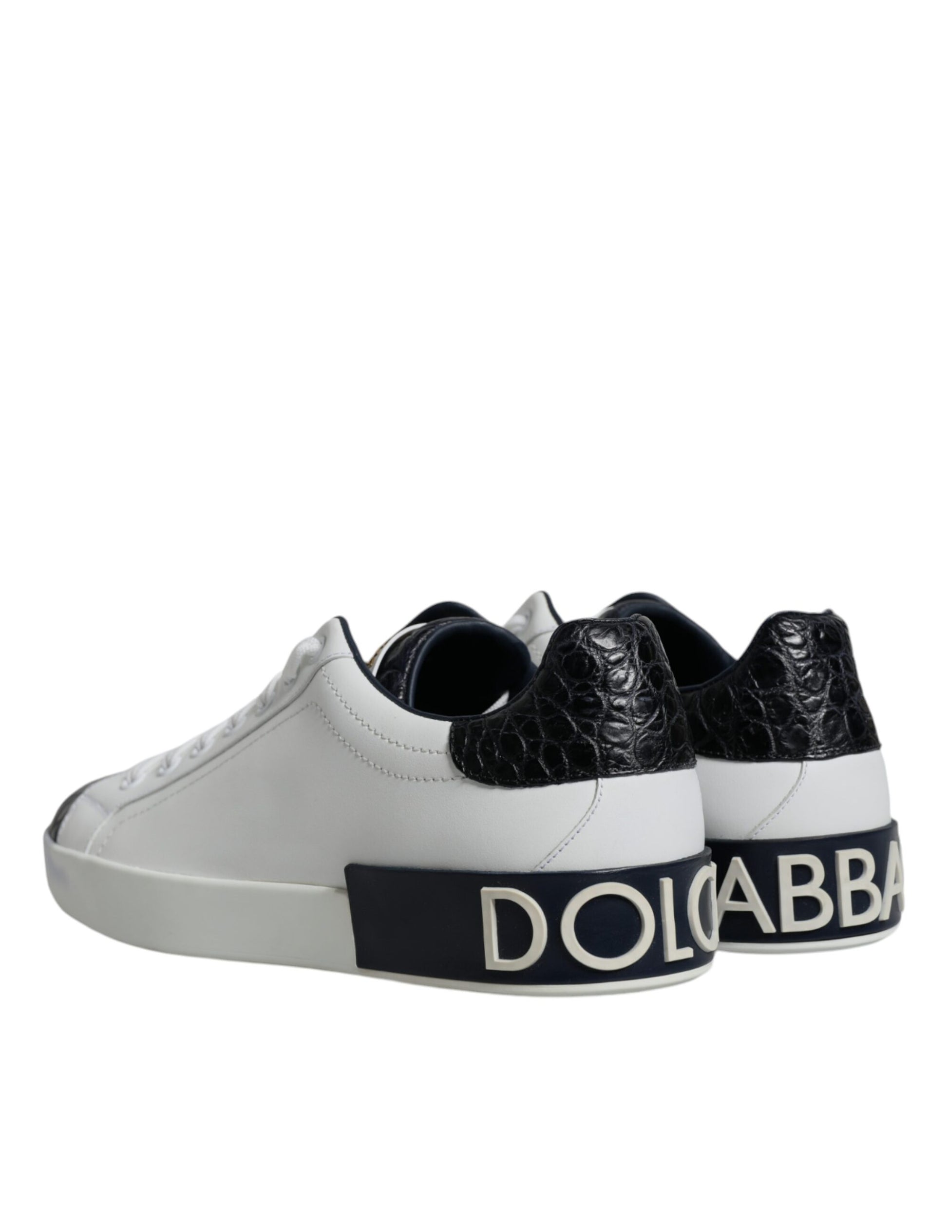Pair of white sneakers with black laces and a logo on the side
