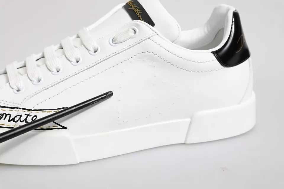White sneaker with black laces and gold accents