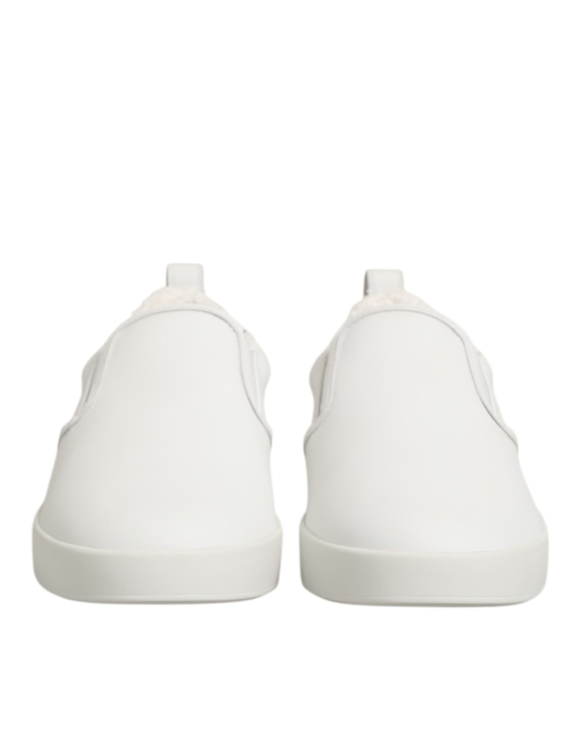 Pair of white leather slip-on shoes with low top and elastic closure