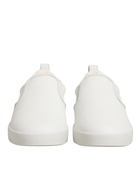 Pair of white leather slip-on shoes with low top and elastic closure