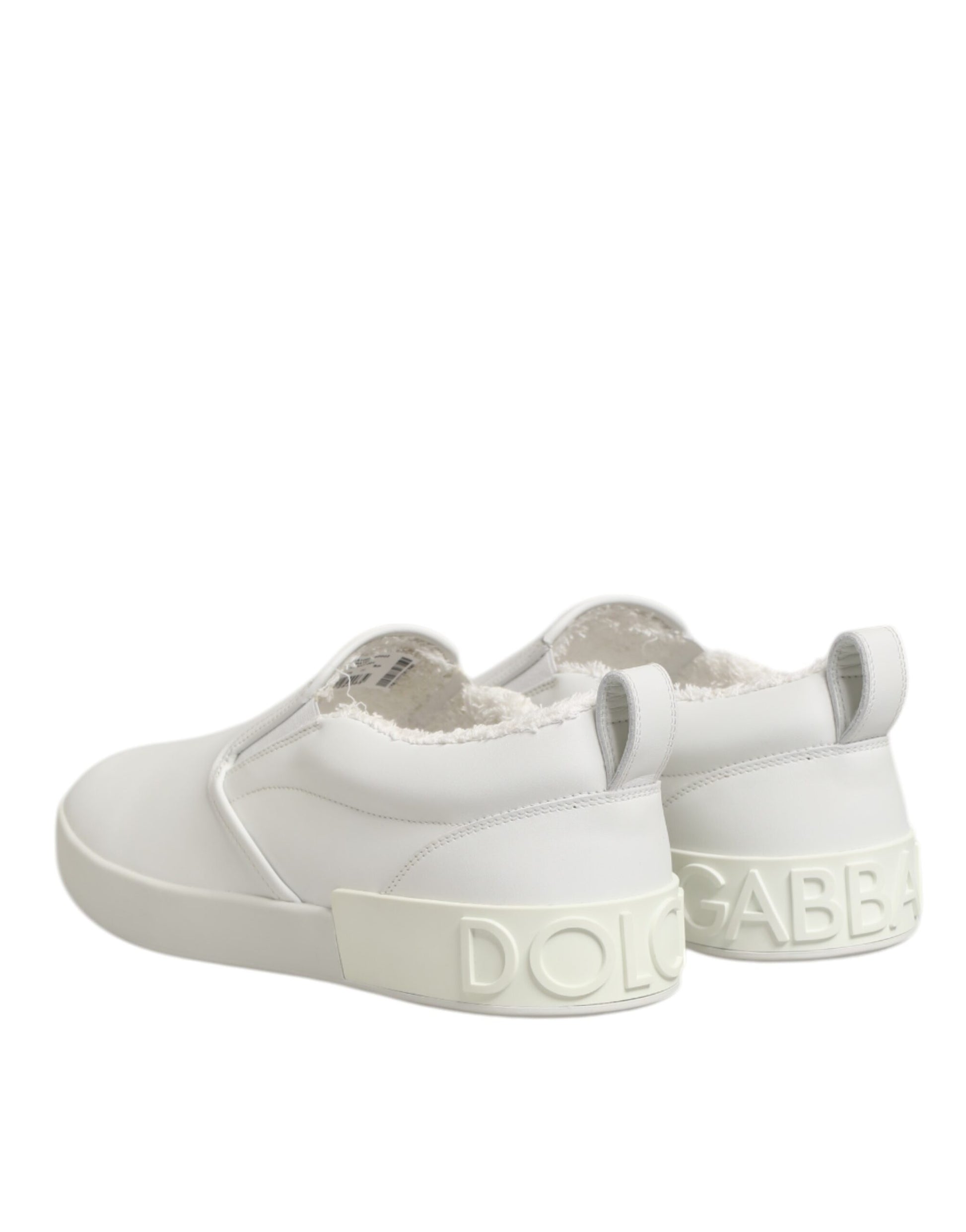 White leather slip-on shoes with brand name on side, featuring low top and elastic panels