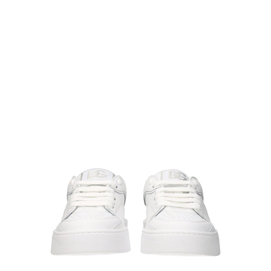 Pair of white leather low top sneakers with silver laces and logo on side