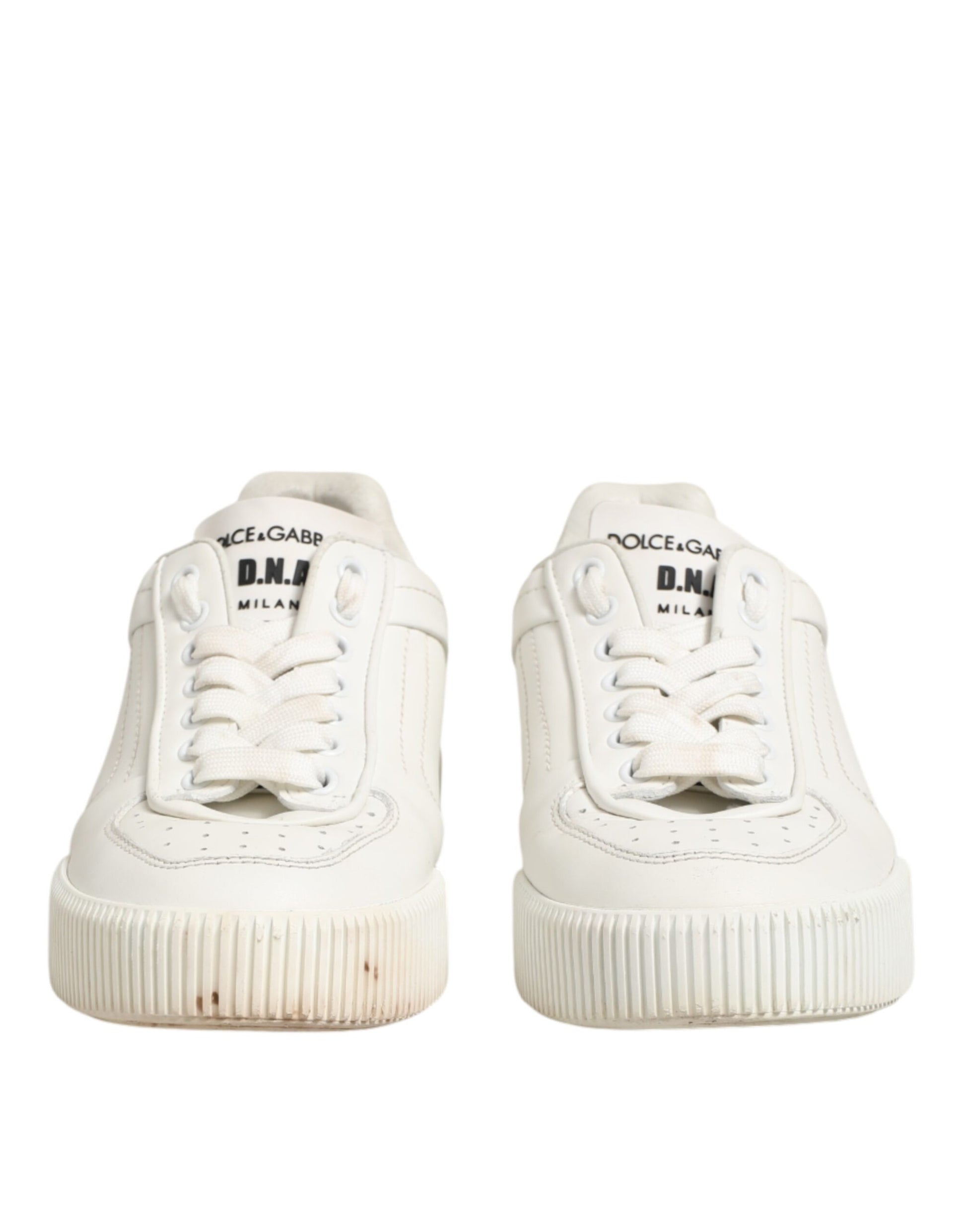 Pair of white sneakers with black laces