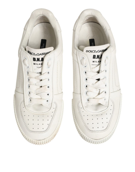 Pair of white sneakers with black laces