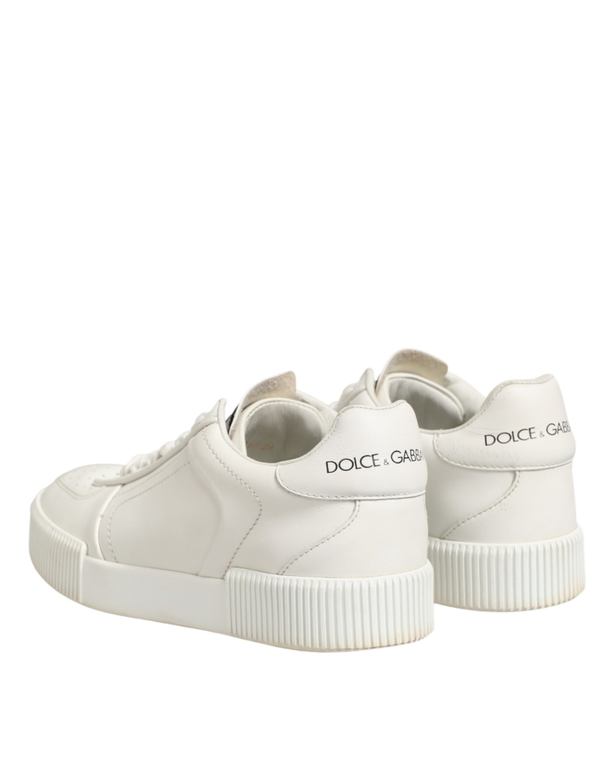 Pair of white sneakers with a logo on the side