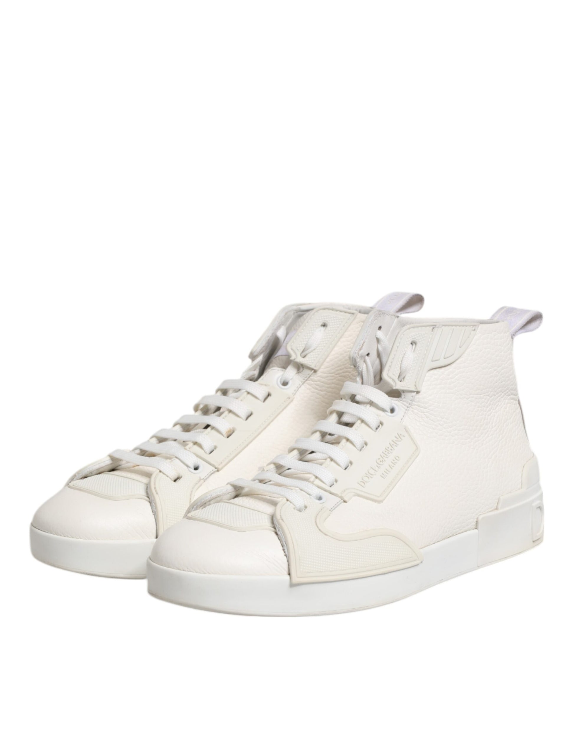 Pair of white leather mid top sneakers with laces and a low-top design, featuring the brand logo on the side