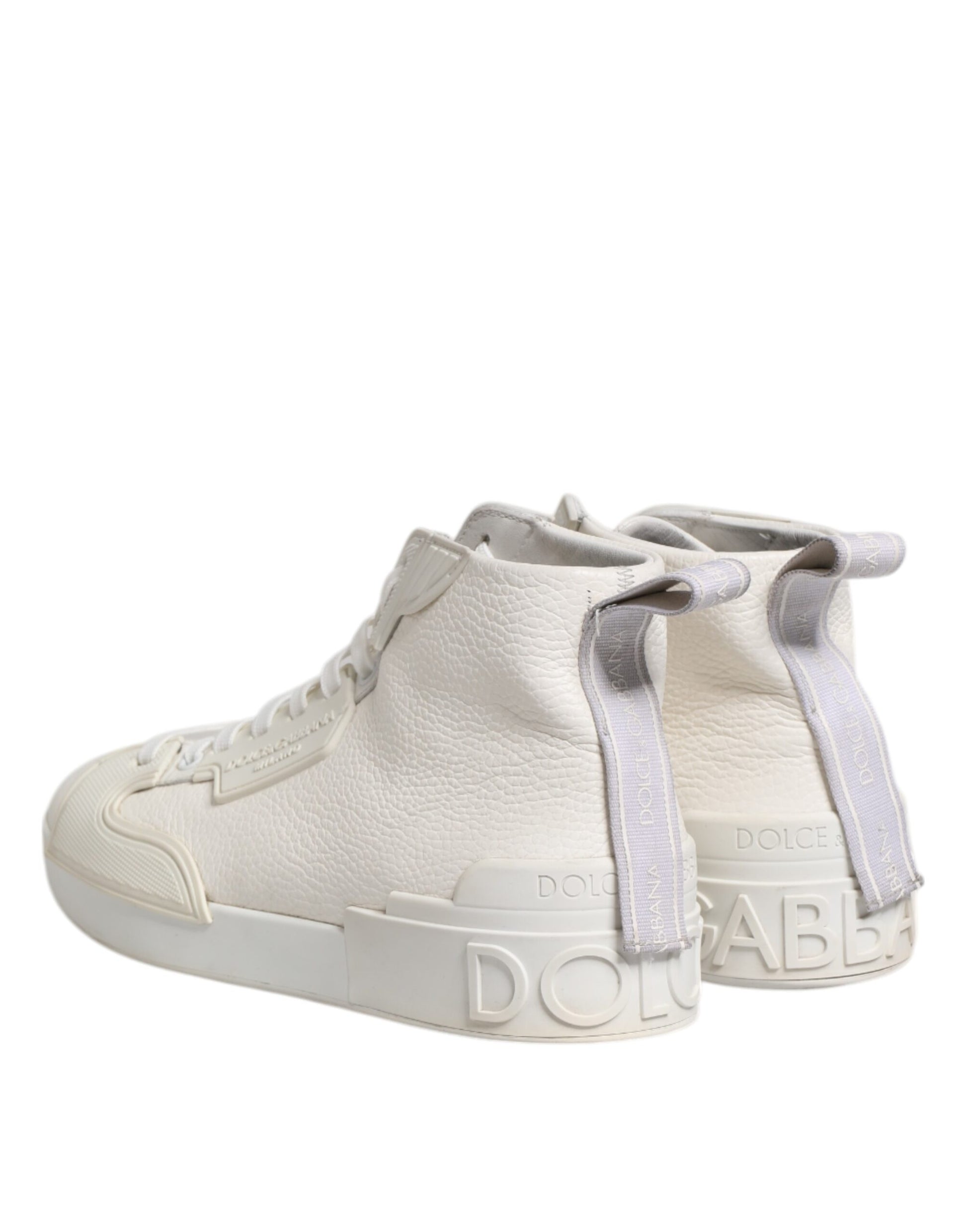 A pair of white leather mid top sneakers with a purple strap and the Dolce & Gabbana logo