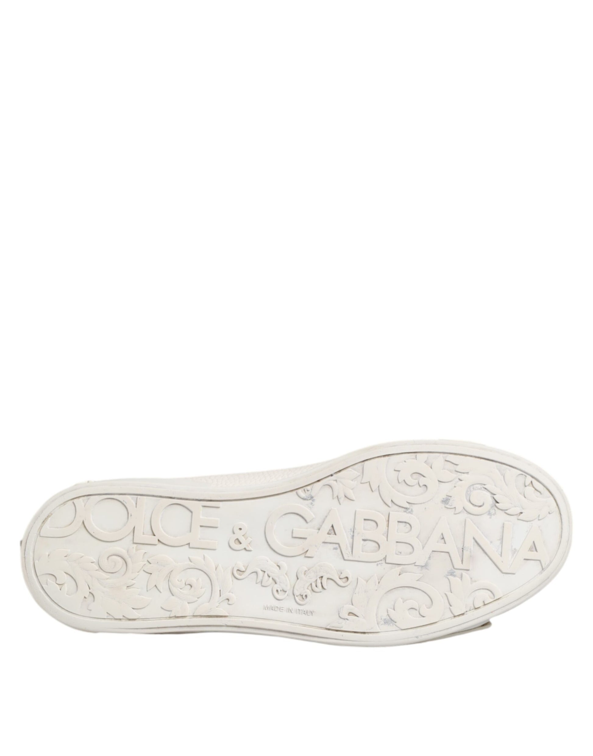 A pair of white leather mid top sneakers with a logo on the side, designed by Dolce & Gabbana