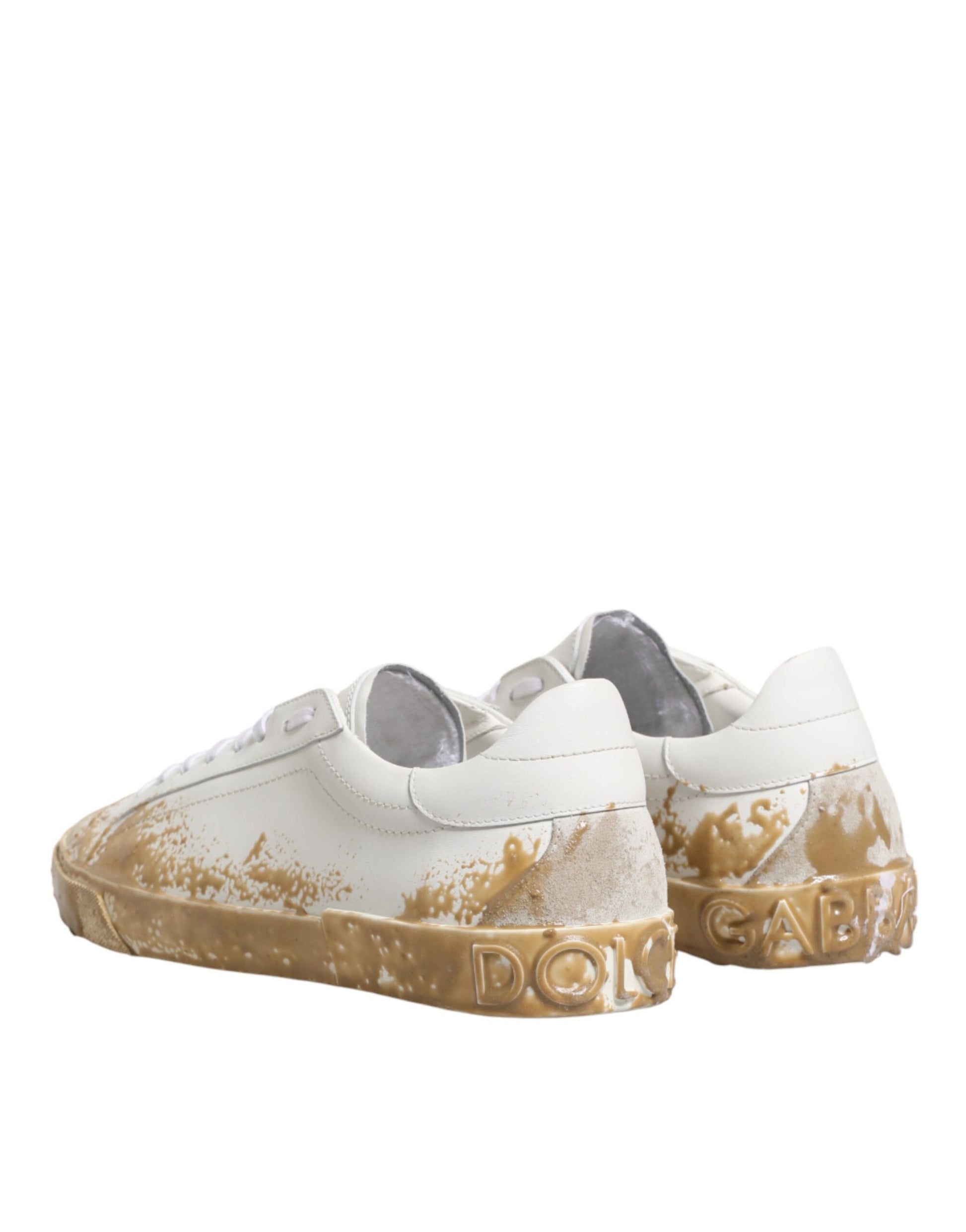 Dirty white sneakers with brown soles