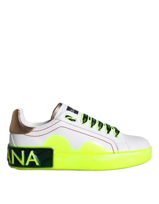 A single sneaker with a white base color and yellow accents on the sole. There is a prominent logo on the side of the sho