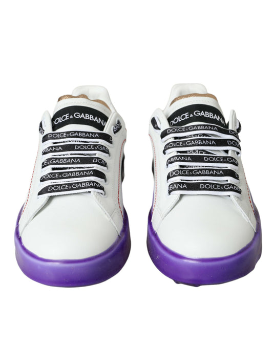Pair of white sneakers with purple soles and black laces