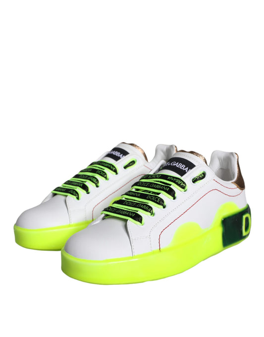 Pair of white and yellow sneakers with green laces