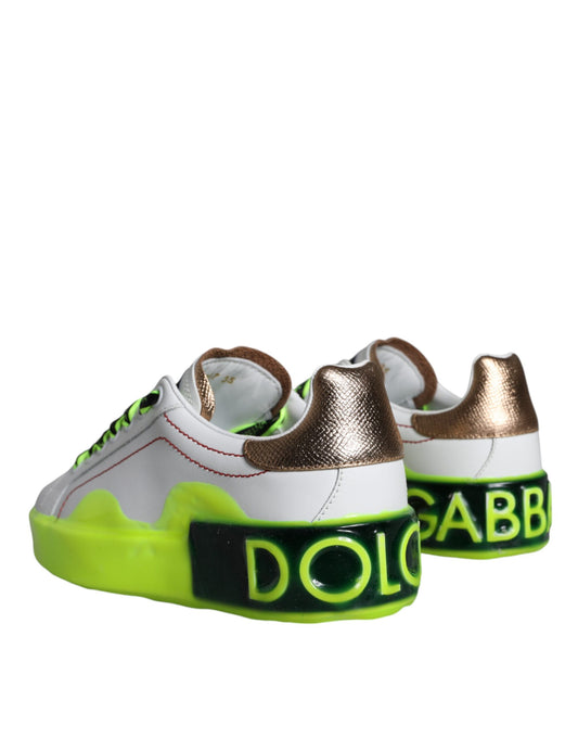 Pair of children's shoes with gold and white accents