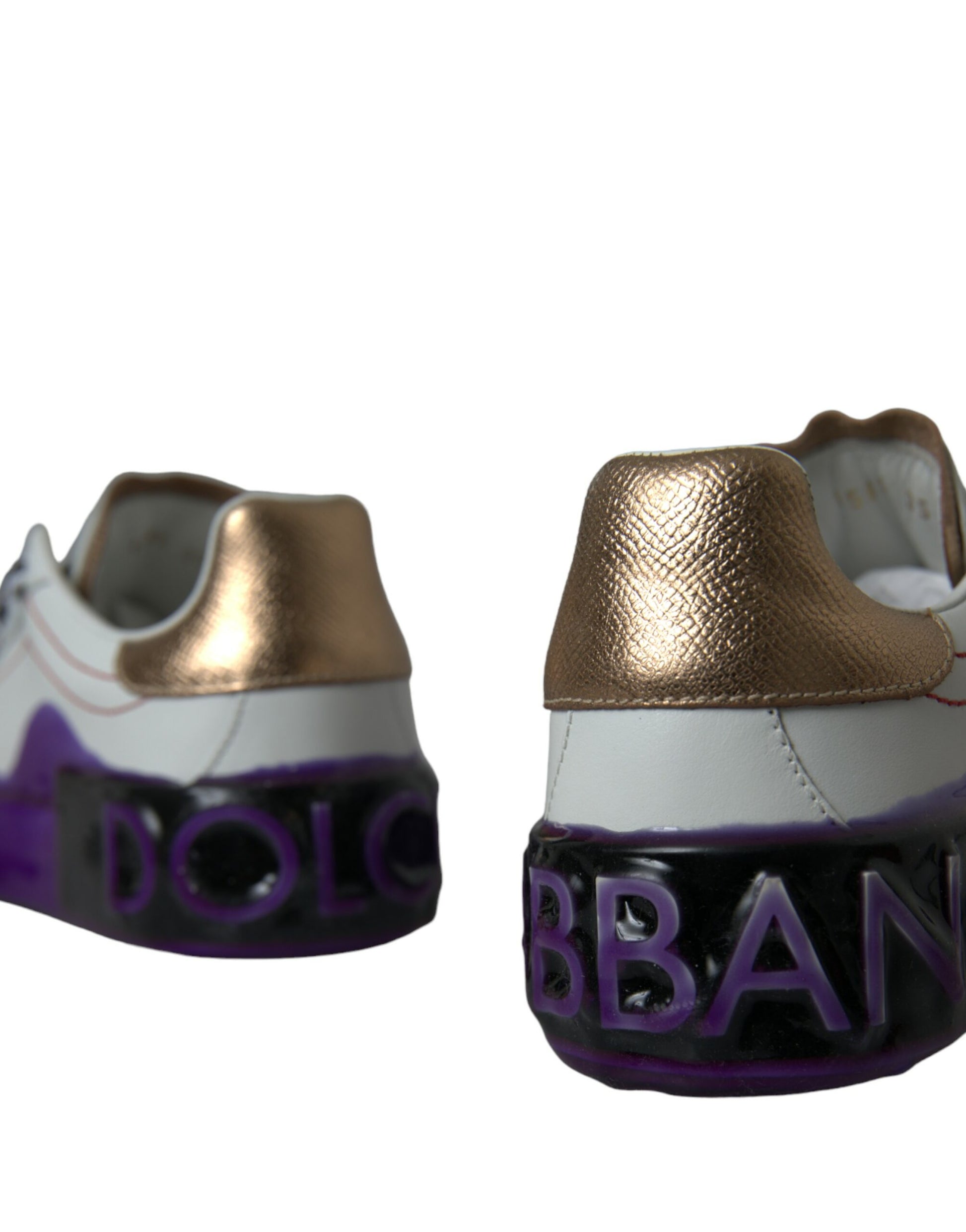 Pair of children's shoes with gold and purple design