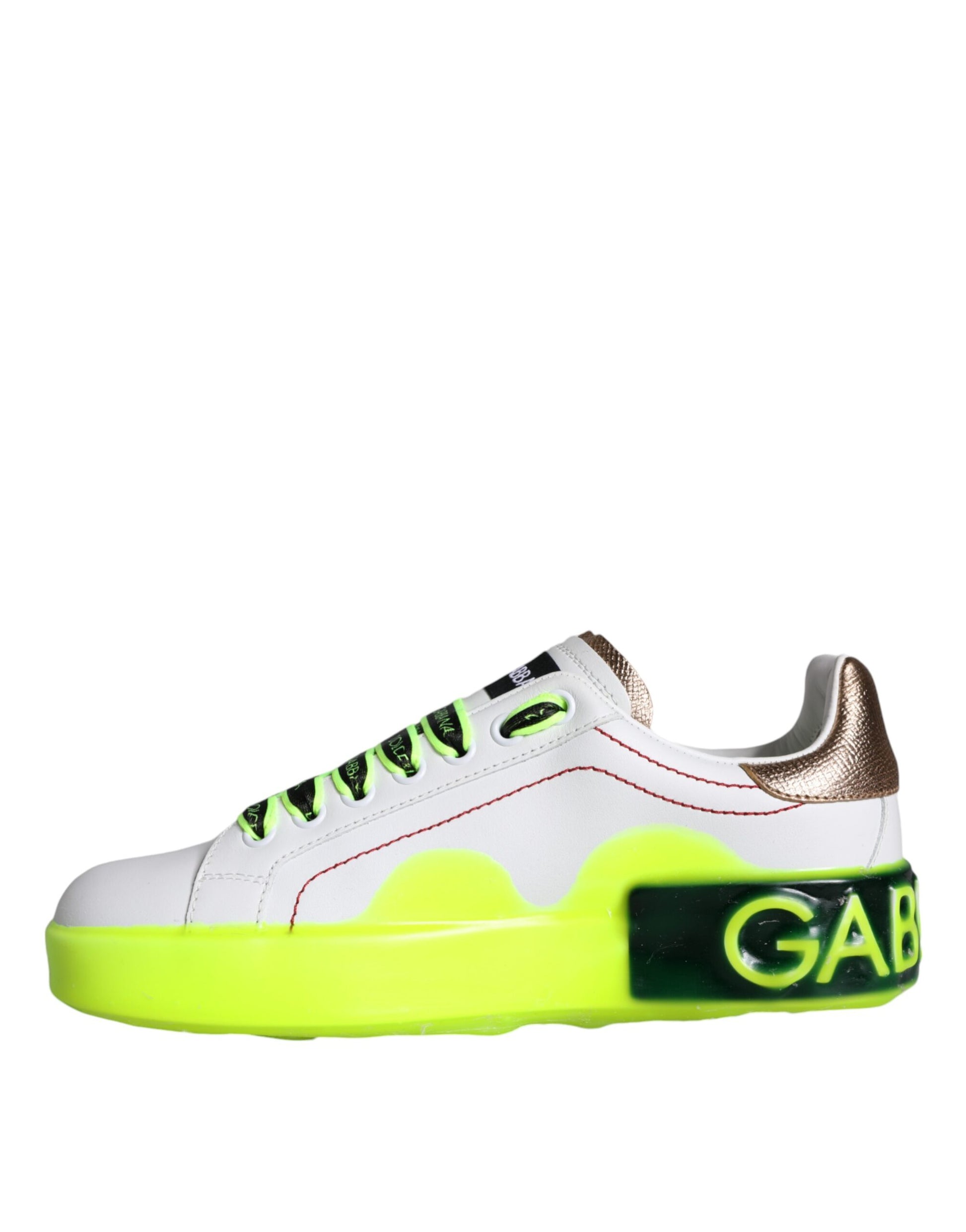 A single sneaker with a white base color and yellow accents on the sole. There are also green details visible on the shoe