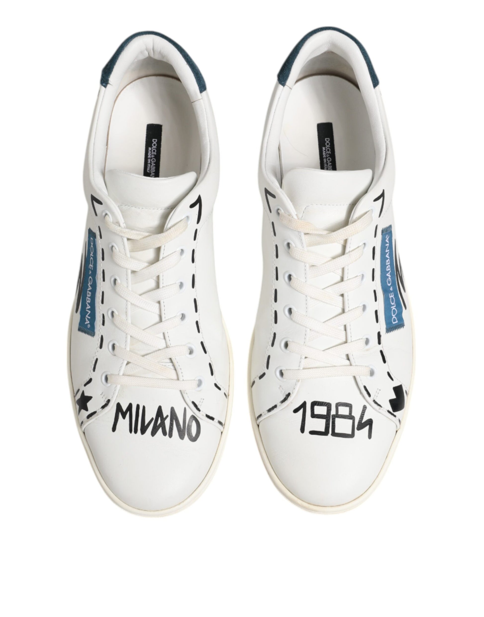 Pair of white sneakers with blue accents