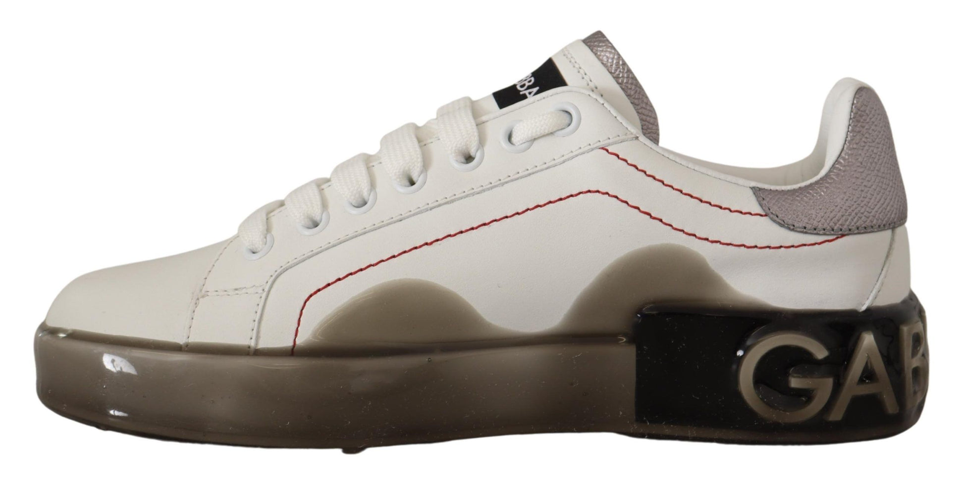 Pair of white sneakers with red accents and a logo on the side