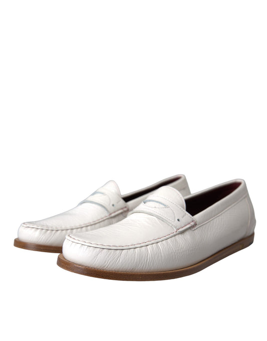 White leather loafer shoes with brown soles