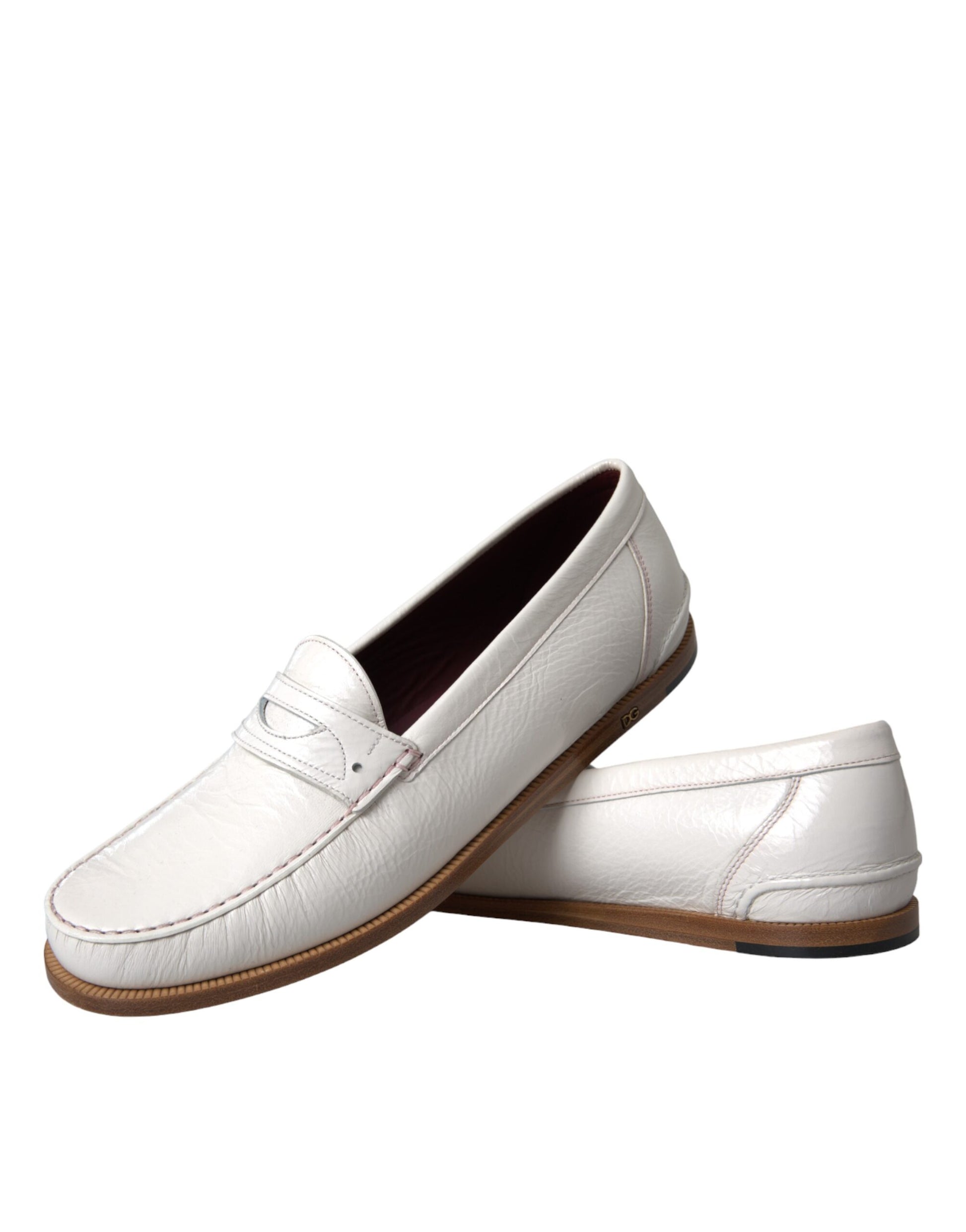 Pair of white loafers with brown soles