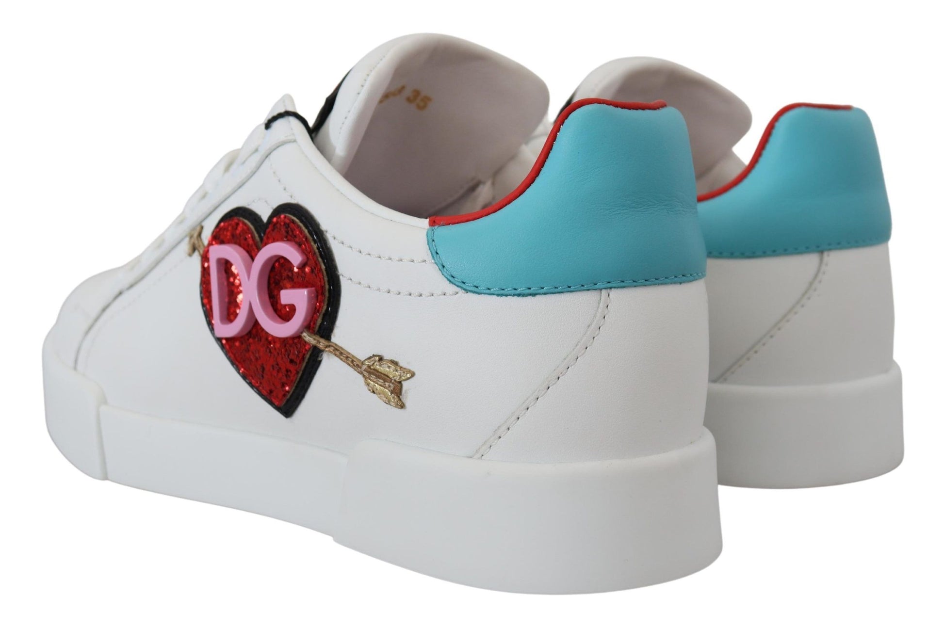 A pair of white leather sneakers with a heart logo and the brand name "D&G" on the side