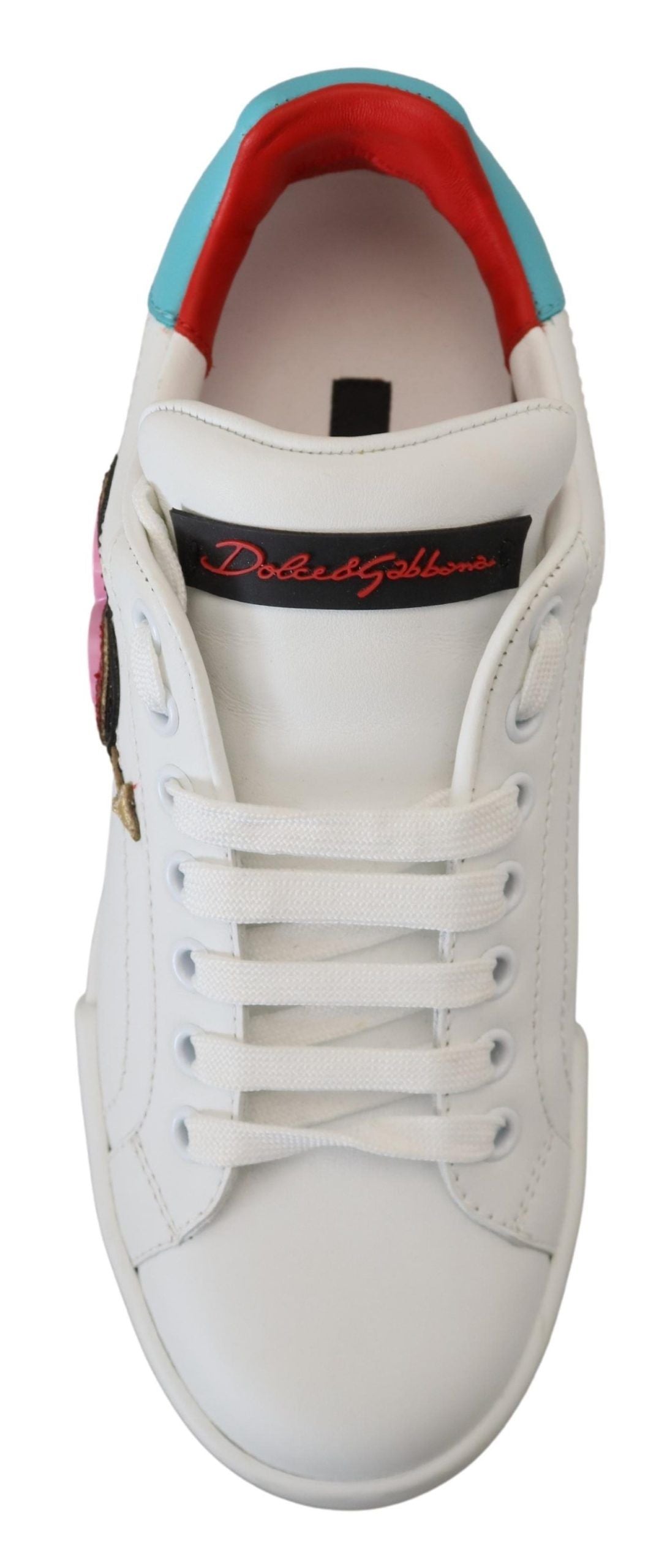 White leather sneaker with red logo and heart design on side